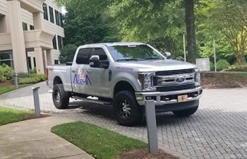Alpharetta Pressure Washing Pickup Truck parked on a driveway in front of a condo